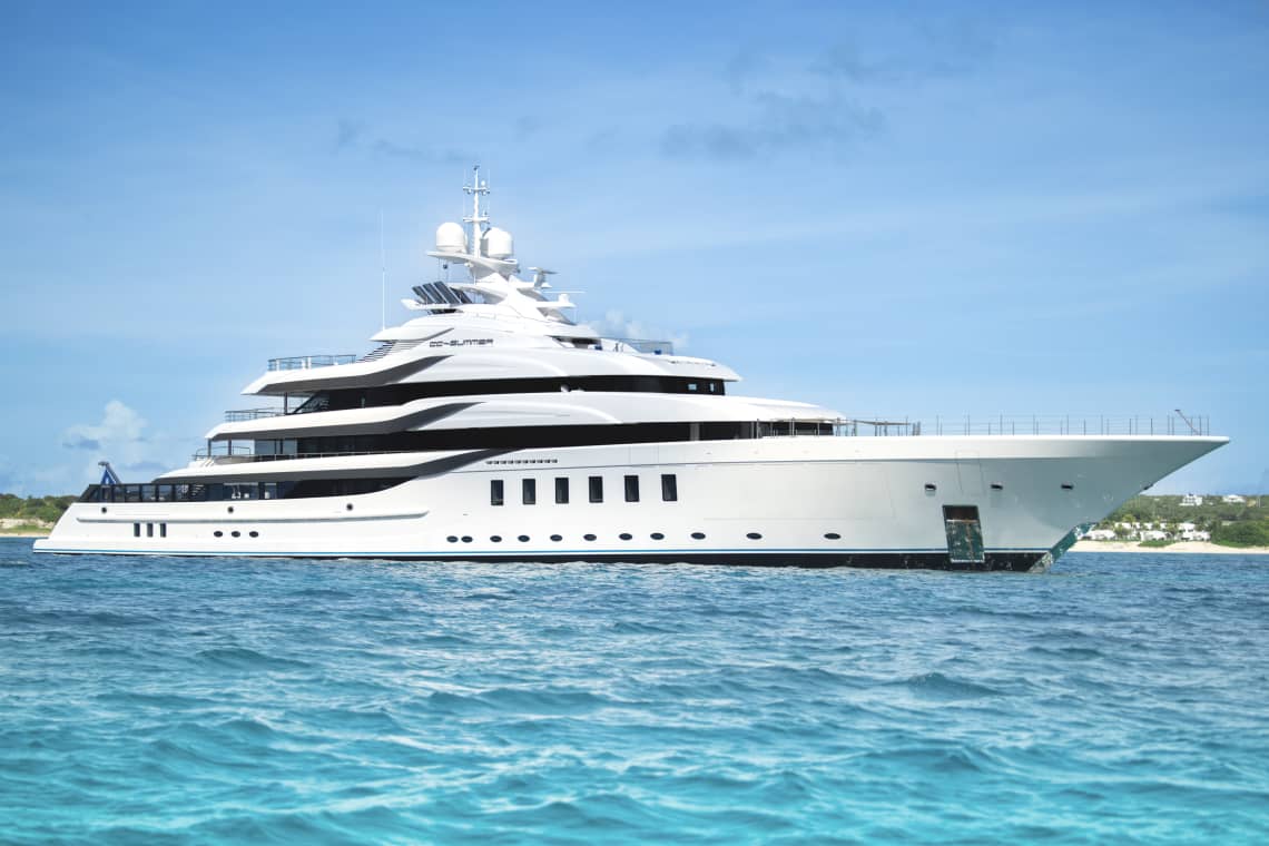 White Superyacht on teal waters