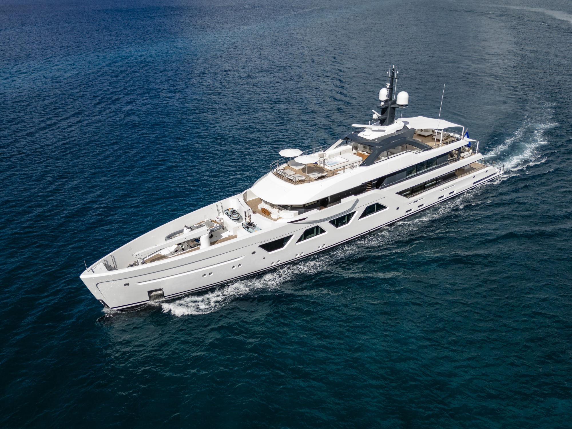 Aerial shot of a yacht on deep blue waters