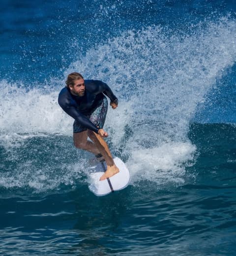 Yacht Broker Travis Motta Surfing