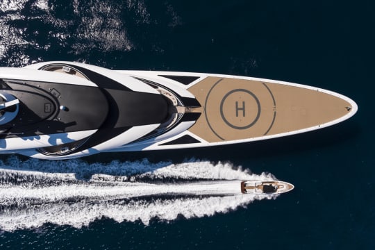 Top View of Yacht next to a boat on the water