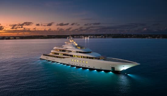 Luxury yacht at night, illuminated on the water