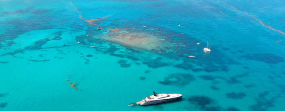 Island aerial view - 15% Discount On UTOPIA IV Charters Through April 30