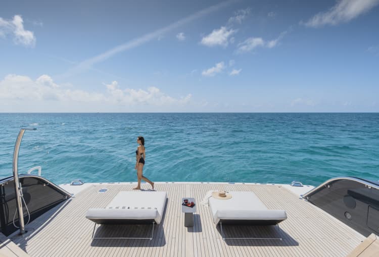 Woman Aboard a Yacht with Blue Ocean in Background