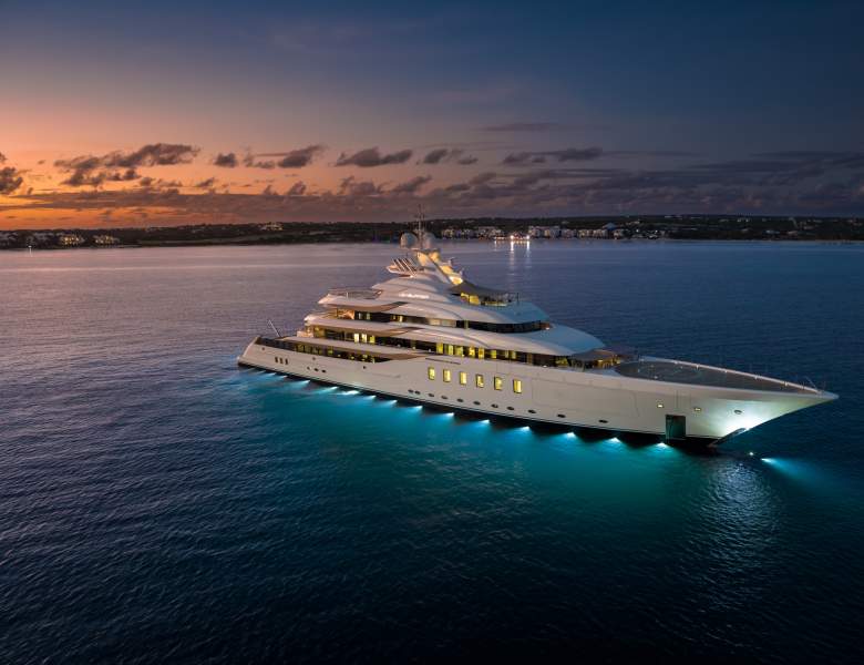 Luxury yacht at night, illuminated on the water